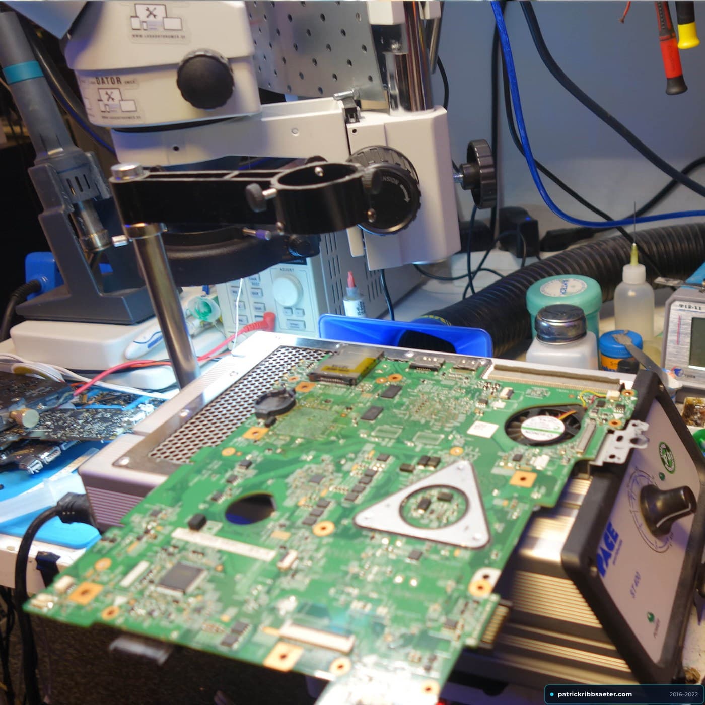 Laptop Motherboard Mounted on PACE Bottom Preheater Under Stereo Microscope and Hot-Air Rework Nozzle